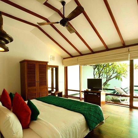 โรงแรมเดอะ เฮอริเทจ มาดูไร มทุราย ห้อง รูปภาพ A bedroom at the resort