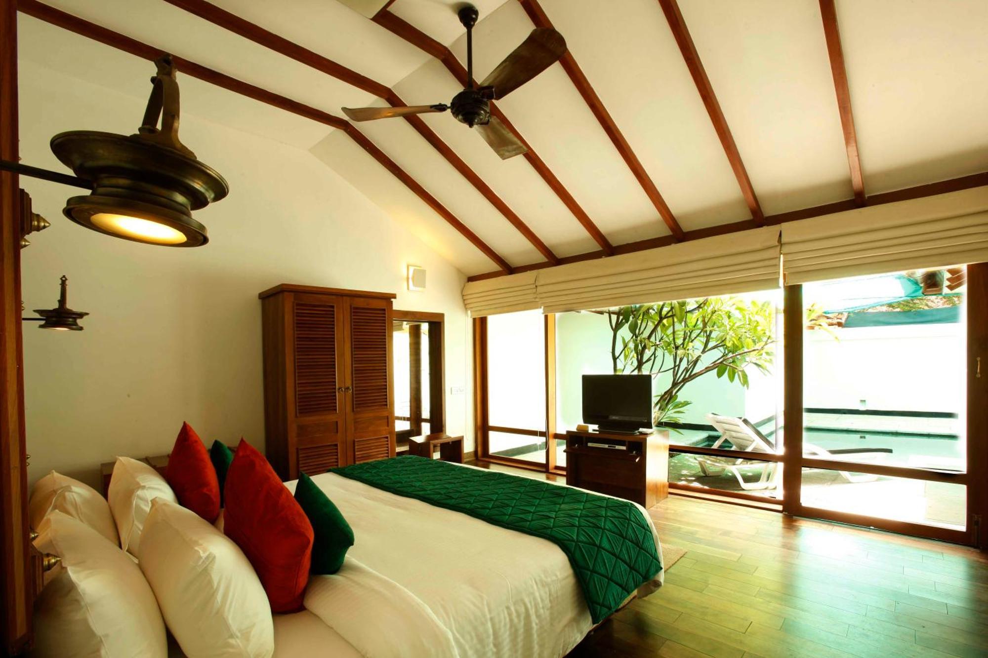 โรงแรมเดอะ เฮอริเทจ มาดูไร มทุราย ห้อง รูปภาพ A bedroom at the resort